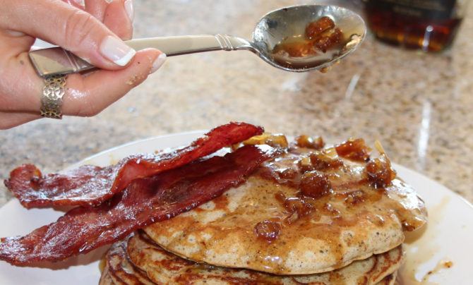 Bacon and maple syrup atop the best protein pancakes ever.