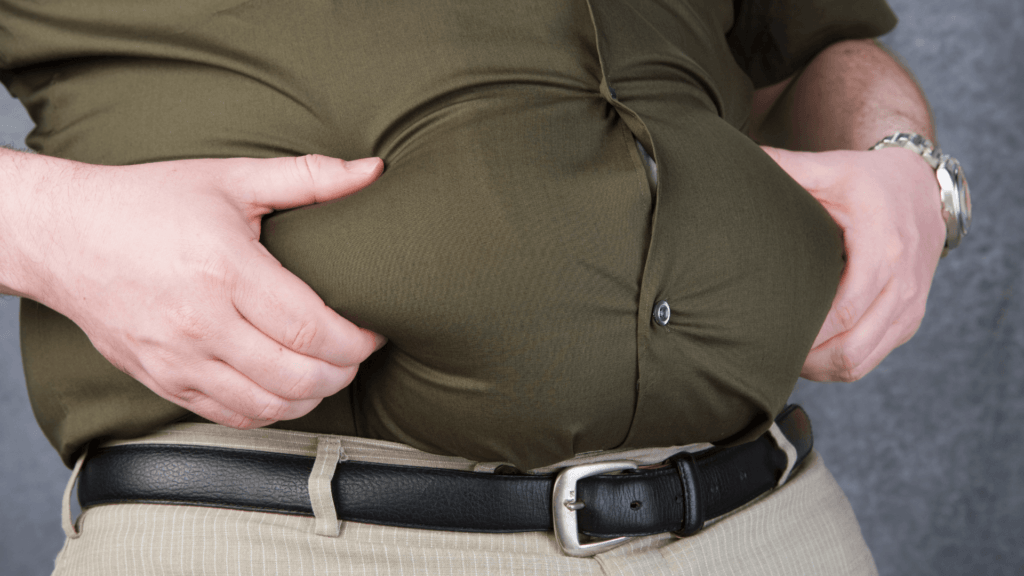 person holding belly fat
