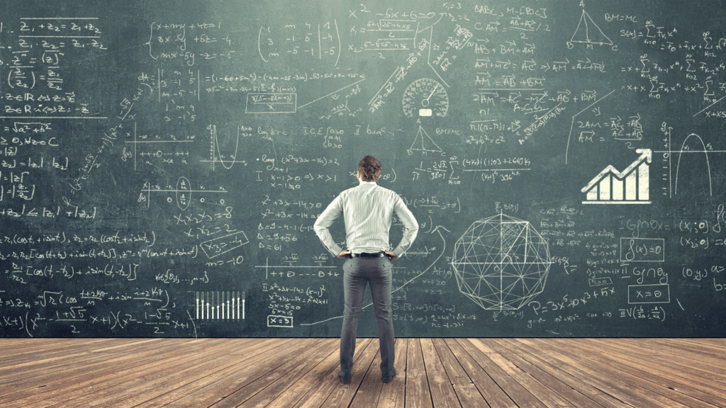 man looking at huge board of equations