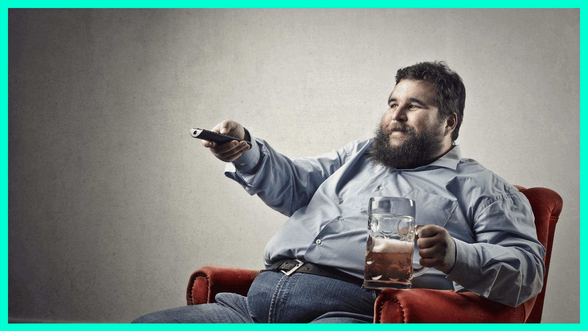 man sitting on couch with beer and tv remote