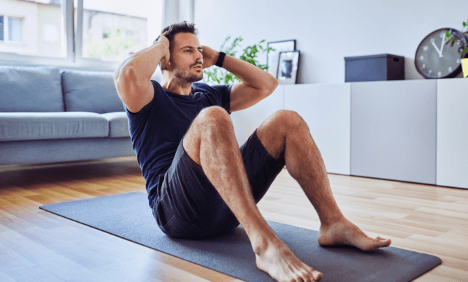 man doing crunches at home