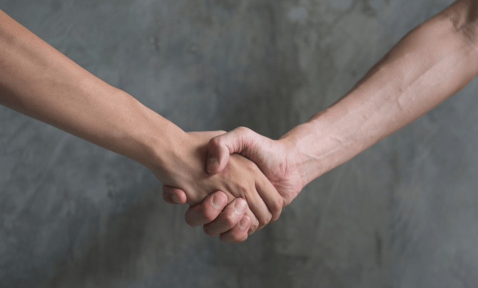 two people shaking hands